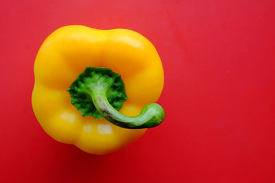 Close-up of bell peppers against red background