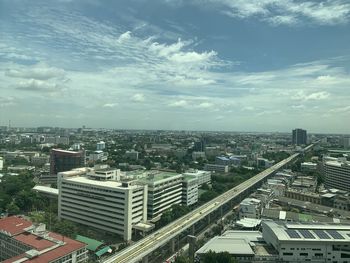 High angle view of buildings in city against sky