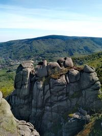 Scenic view of rock formations against sky