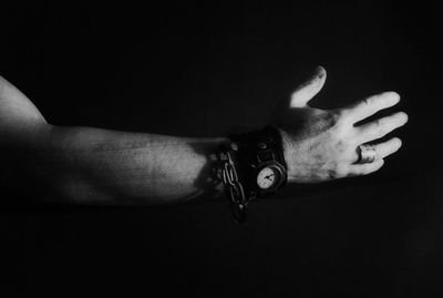 Close-up of hands over black background