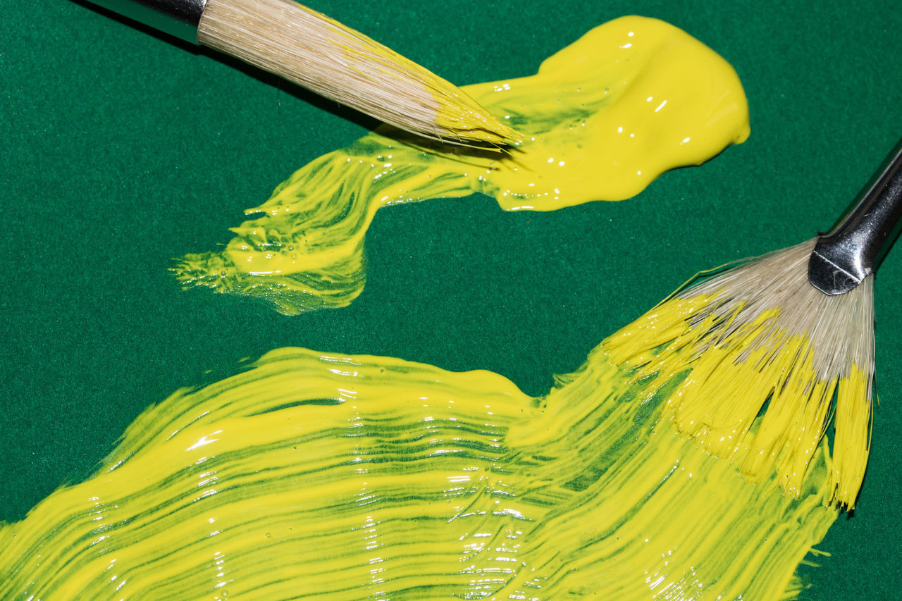 yellow, close-up, no people, green color, indoors, kitchen utensil, brush, still life, paintbrush, high angle view, water, fork, eating utensil, motion, food and drink, freshness, food, creativity, paint