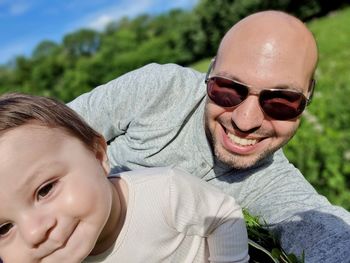 Portrait of smiling man wearing sunglasses