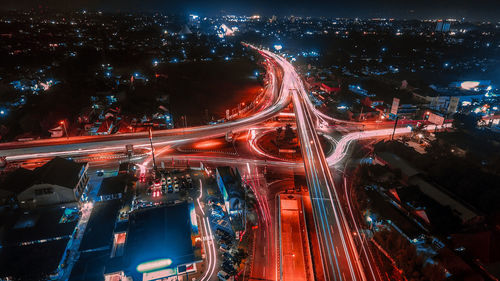 High angle view of illuminated city street at night