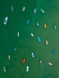 High angle view of fishing boats moored at sea