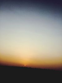 Scenic view of landscape at sunset