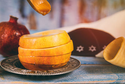 Close-up of orange juice on table