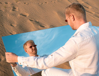 Side view of man standing on beach