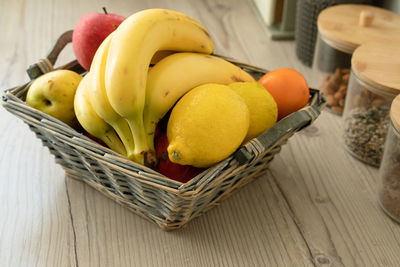Close-up of fruits in basket on table