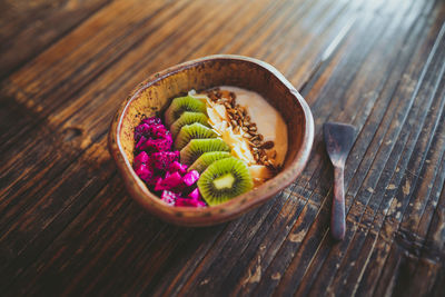 High angle view of candies in bowl on table