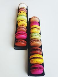 Close-up of multi colored candies against white background