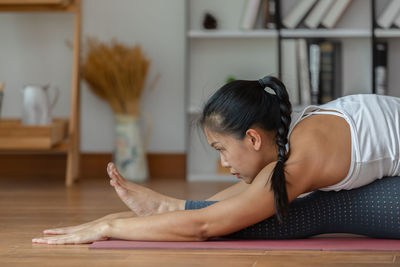 Midsection of woman sitting at home