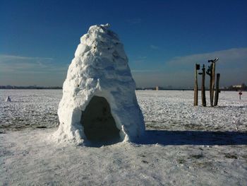 Scenic view of beach against sky during winter