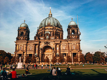 Group of people in front of berliner dom against sky