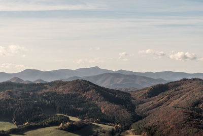 Scenic view of mountains against cloudy sky