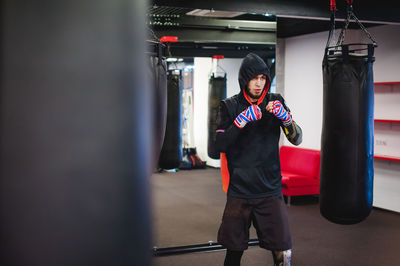 Thoughtful man practicing boxing