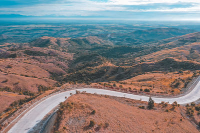 High angle view of road amidst landscape against sky