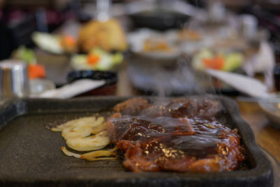 Close-up of meat on barbecue grill