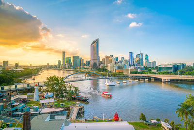 Bridge over river with buildings in background