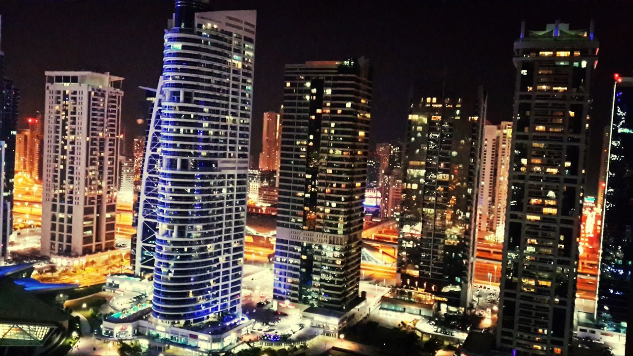 building exterior, city, illuminated, architecture, night, built structure, skyscraper, cityscape, tall - high, modern, tower, office building, financial district, city life, residential building, capital cities, crowded, building, urban skyline, downtown district