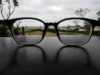 Close-up of reflection of sunglasses on glass