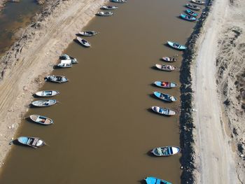 High angle view of cars on sand against sky