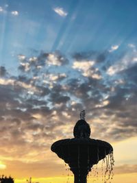 Low angle view of statue against sky during sunset