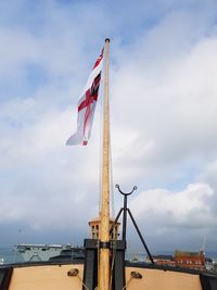 Low angle view of flag against sky