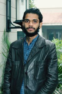 Portrait of young man standing outdoors