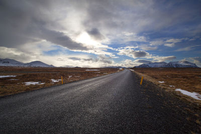 Snowy volcano landscape with dramatic clouds in west iceland