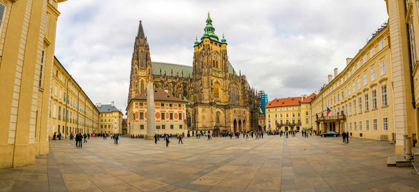 Panoramic view of buildings in city against sky