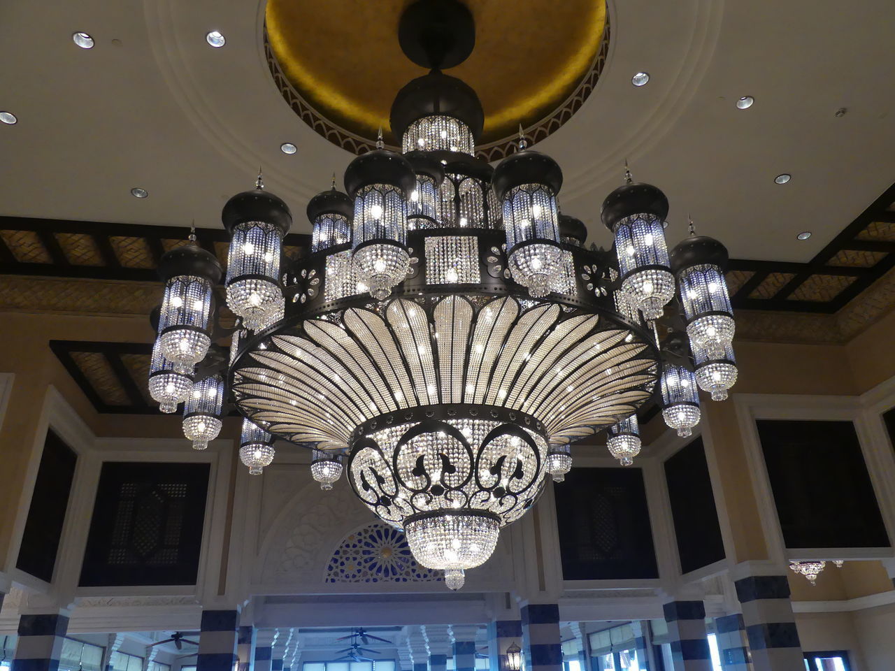 LOW ANGLE VIEW OF ILLUMINATED CHANDELIER