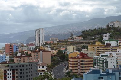 High angle view of buildings in city against sky