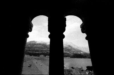 Silhouette of building seen through window