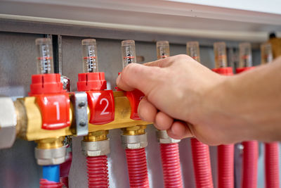 Cropped hand of person holding equipment