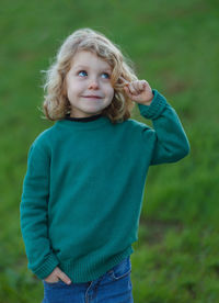 Portrait of cute girl standing on land