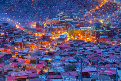 High angle view of illuminated buildings at night