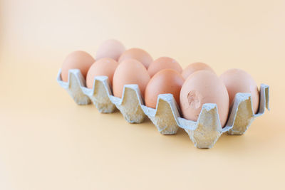 Close-up of eggs against white background