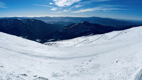 Scenic view of snowcapped mountains against sky