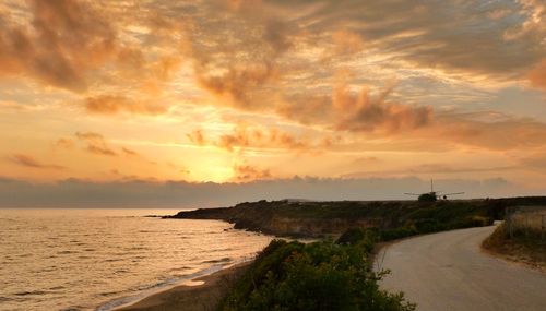 Scenic view of sea against sky at sunset