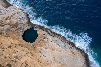 Aerial drone view of giola lagoon, a natural seaside pool in thassos, greece