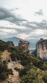 Scenic view of mountain against cloudy sky