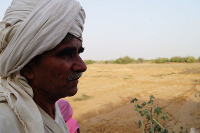 Close-up of man wearing turban in village