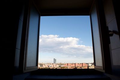 View of cityscape through window