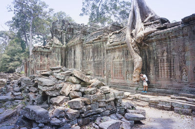 Low angle view of historic building amidst trees