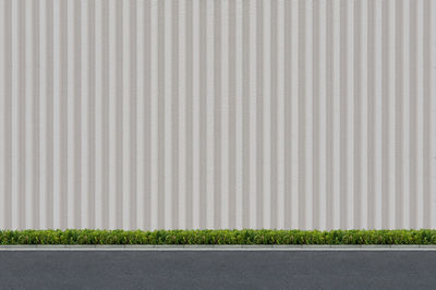 Surface level of road against wall