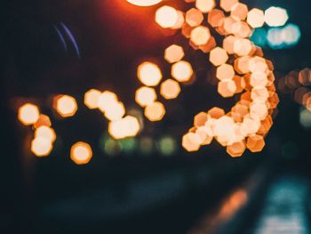 Defocused image of illuminated lights at night