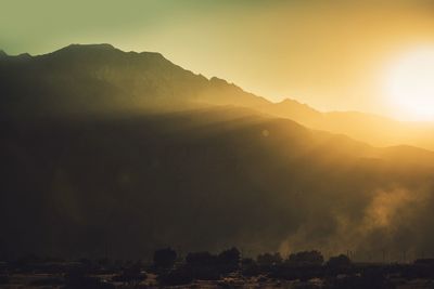 Scenic view of silhouette mountains against clear sky