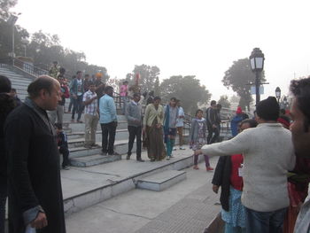 People on sidewalk in city