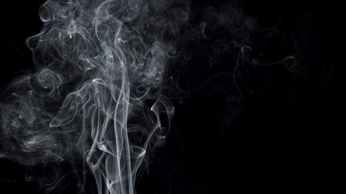 Close-up of smoke against black background