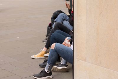 Young woman sitting on floor